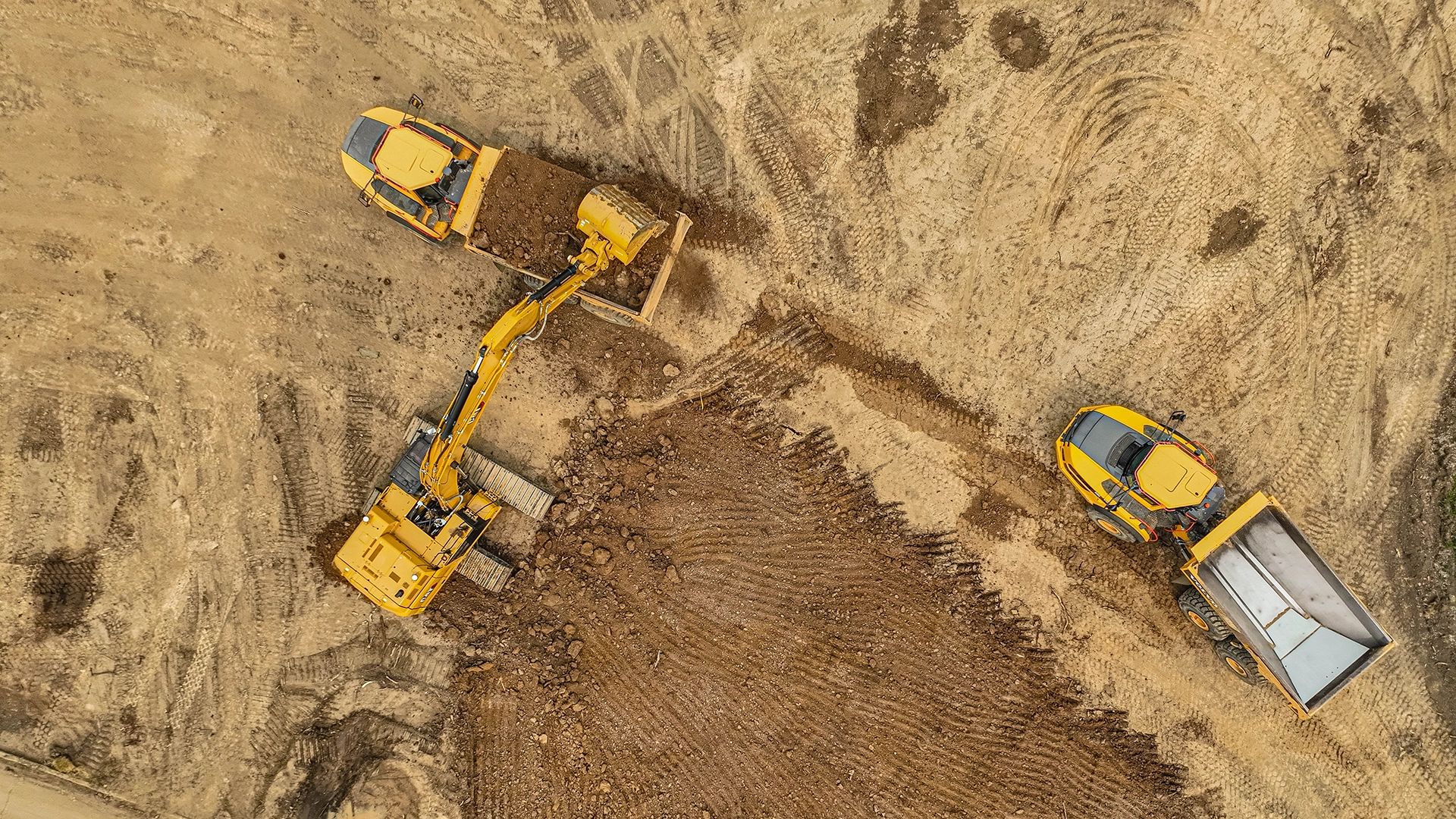 aerial view of heavy equipment moving dirt