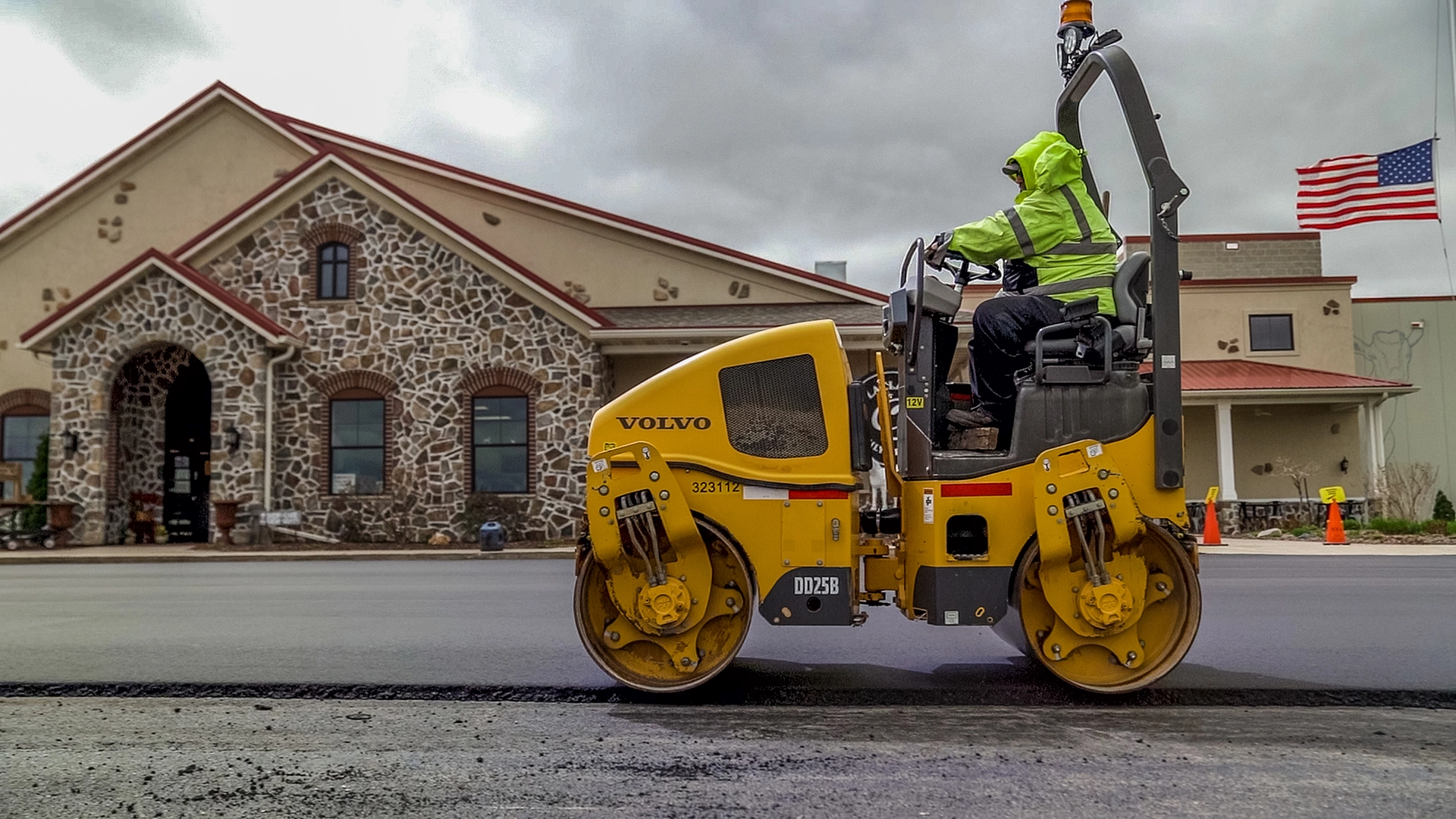 man on steamroller paving